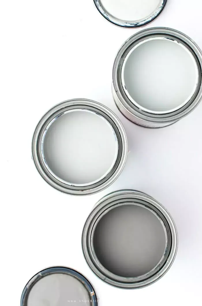 Open cans of green paint