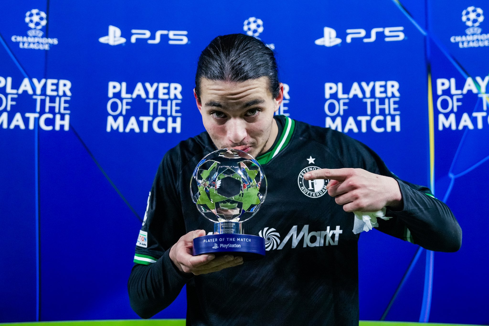 Feyenoord forward, Hadj Moussa, takes a shot with his Player Of The Match award following his amazing performance for the Dutch side against Manchester City in the UCL 2024/25 League Phase match at Etihad Stadium on Tuesday 26 November, 2024