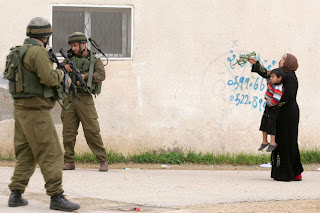 Soldiers in the West Bank with displaced civilian