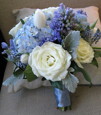 white rose bouquet with blue ribbon. The maids#39; ouquets featured