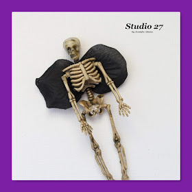 Make your own Halloween skeleton fairy using Dollar Tree supplies.