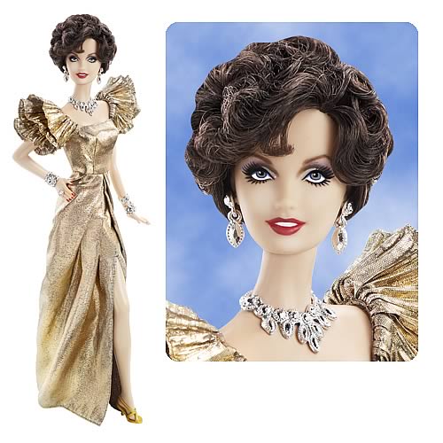 This replica of Joan Collins is dressed in a golden lame gown with ruffle