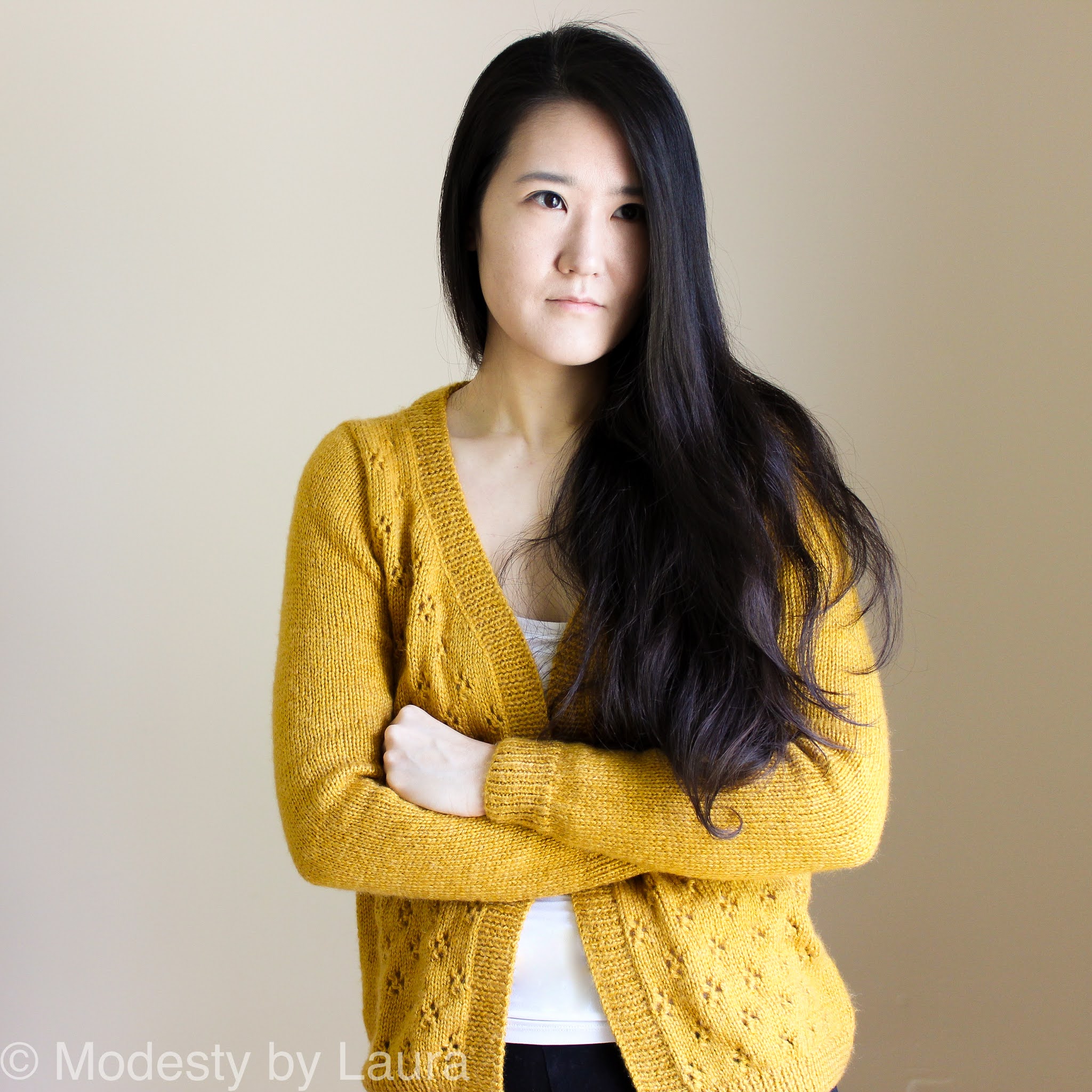 Designer of Modesty by Laura wearing a knit Cheese in the Trap Cardi