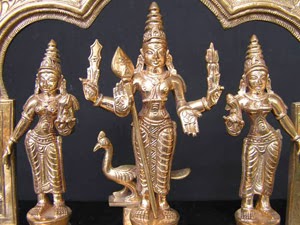 Kartik riding a peacock accompanied by his two consorts; Devayani and Sundaravalli; South Indian Bronze.