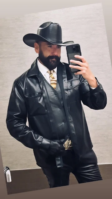 Black leather suit and gloves bearded cowboy selfie