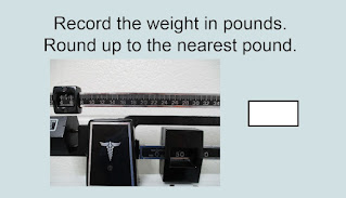 Record the weight in pounds. Round up to the nearest pound. Arrows are at 50 and 5.