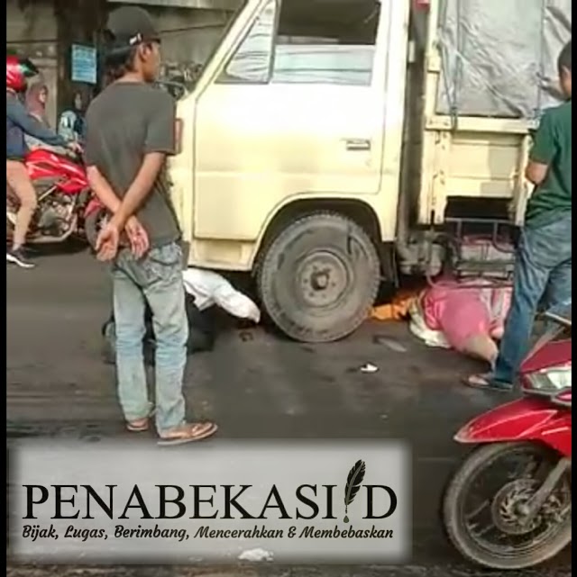 Tergelincir karena jalan licin seorang wanita masuk kedalam kolong truck engkel