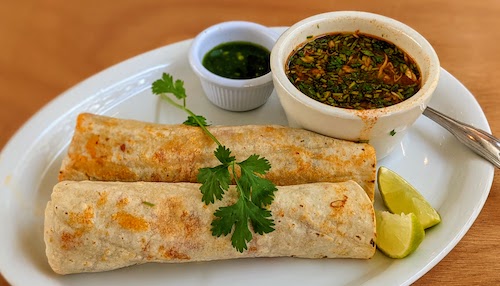 Tacos de barbacoa enchilada with consomé