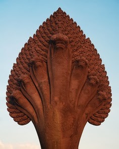 Ananta-Sesha, the serpent with many heads who supports the earth; Deccan stone carving 