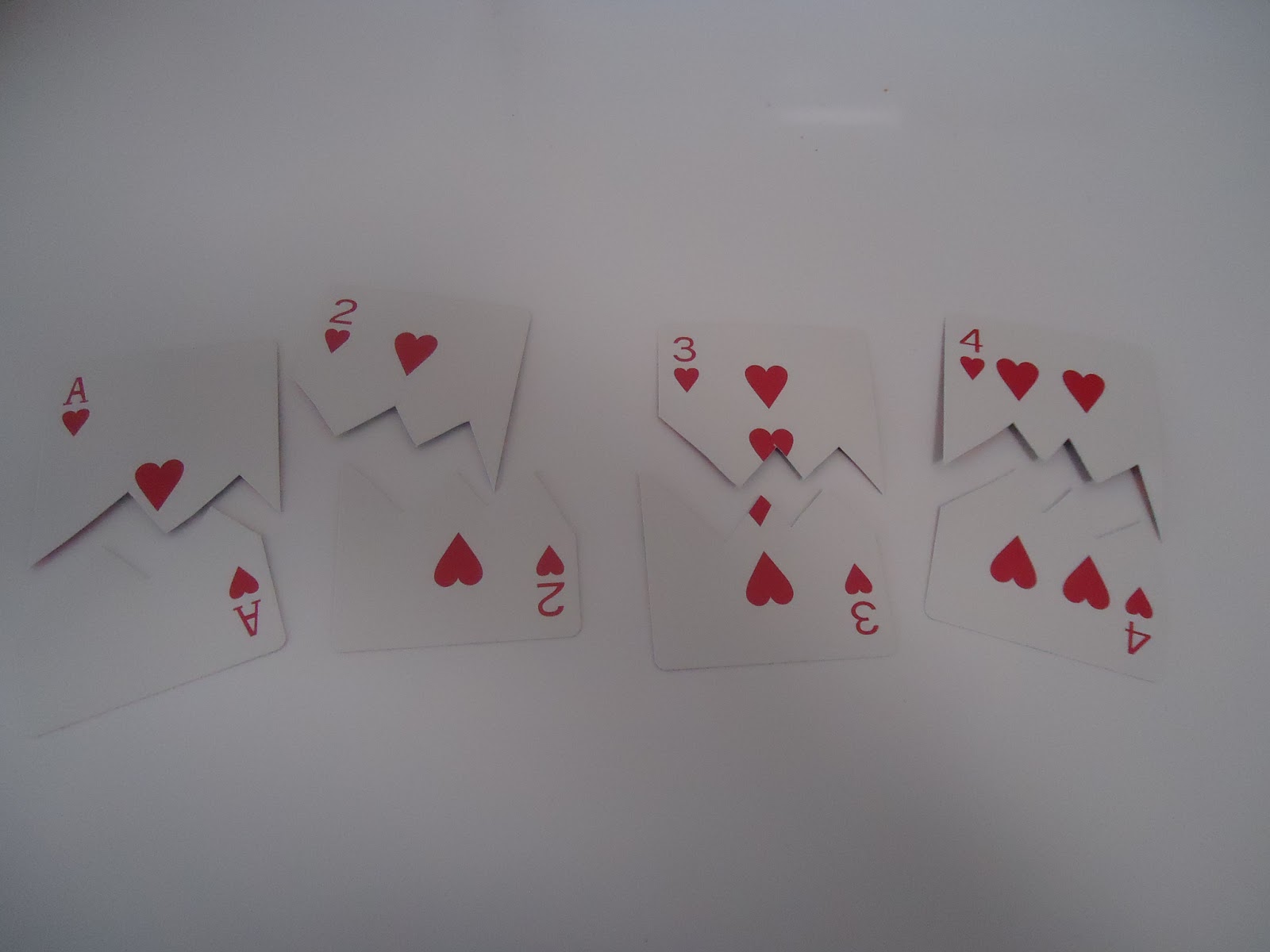 Cut each card in a zig-zag pattern horizontally.