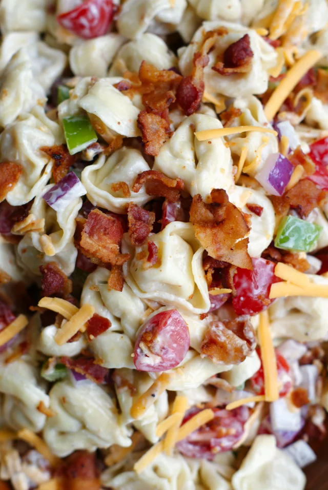 Bacon Ranch Tortellini Salad in a wooden bowl.