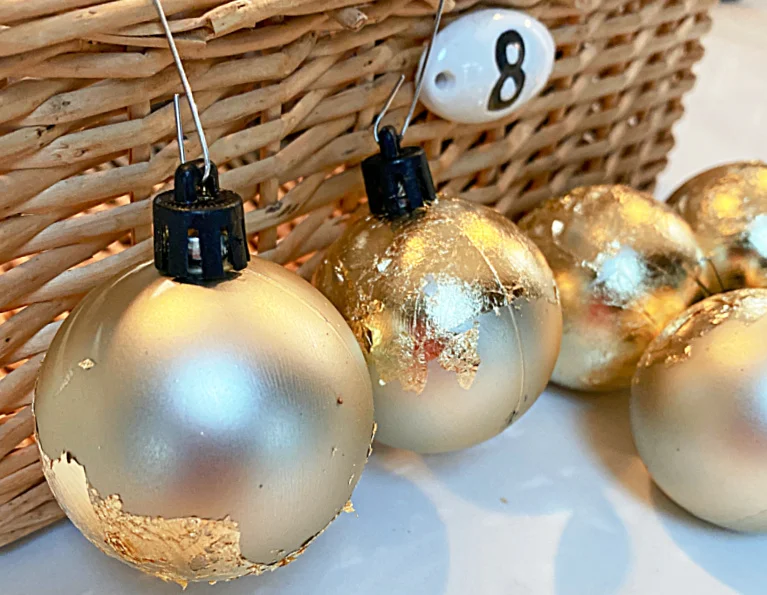 gilded gold leafed dollar tree ornament on basket