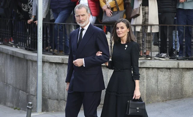 Queen Letizia wore a black tweed dress and pearl diamond brooch. King Felipe attended Fernando Gomez Acebo's funeral