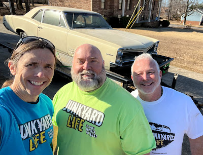 Jody, Keith and Ron in front of their latest purchase, a 1966 Pontiac Tempest in yellow.