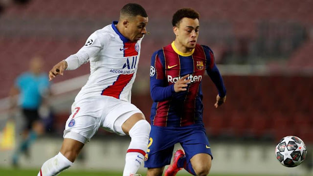 Mbappe in action against Barcelona at the Nou Camp in the Champions League.