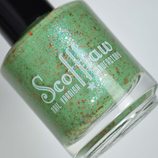 green nail polish with shimmer in a bottle