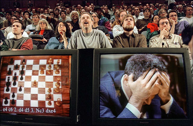 Spectators watch a broadcast of the final, decisive game in the rematch between Garry Kasparov and the IBM computer Deep Blue. May 11, 1997.