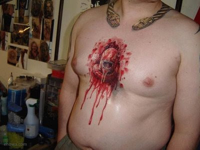 Here is a weird tattooA baby alien coming out of a guy's chest 
