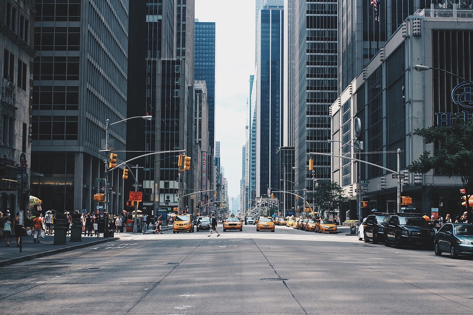 Cars waiting pedestrians cross the street