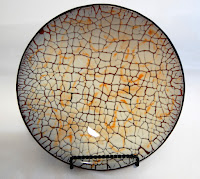 Amber-backed almond crackle with amber powder design.