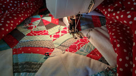 Red and aqua string star round robin quilt