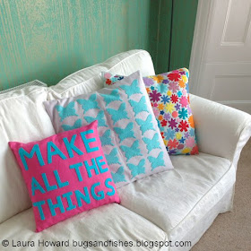 three cushions / pillows decorated with felt