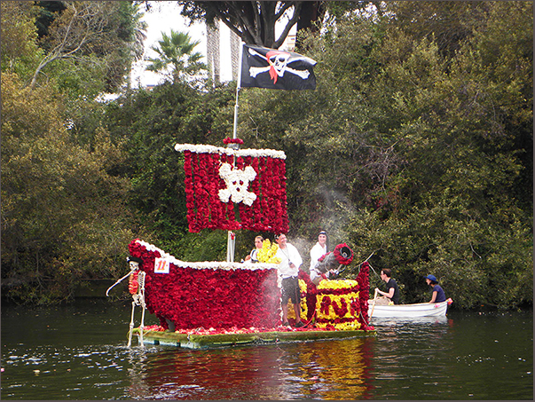 dark red pirate ship with yellow, pirate flag and exploding begonia cannon