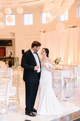 bride and groom smiling in reception