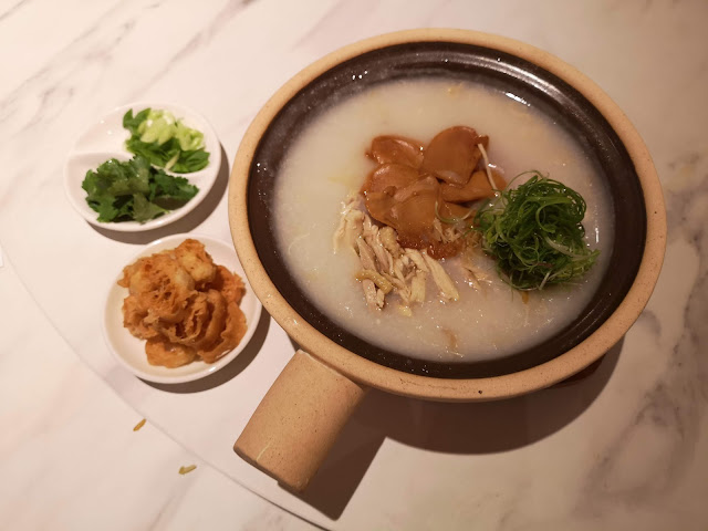 Abalone and shredded kampung chicken with conpoy congee served in claypot