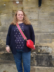 Middle aged woman with bright bag