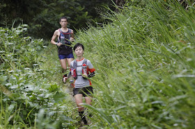 Running enthusiasts in action at Bukit Timah Nature Reserve