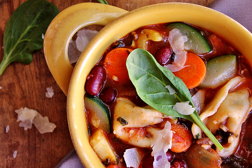 This hearty homemade Tortellini Minestrone features handmade spinach ricotta tortellini and a feast of fresh harvest vegetables sure to comfort in any season.