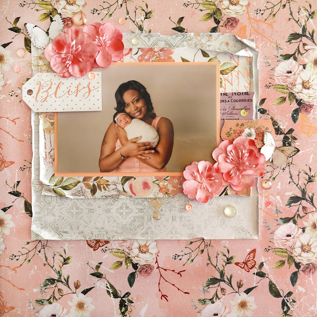 newborn photography scrapbook layout made with Prima Marketing Apricot Honey, paper flowers, fussy cut butterfly ephemera, color mists, sequins and jewels