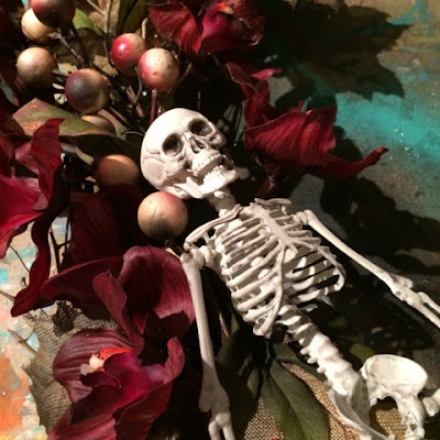 Skeleton laying in hand-painted berries and flowers - Yay for Halloween!