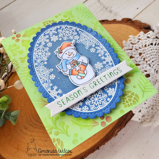 Season's Greetings Snowman Card by Amanda Wilcox | Snowman Greeting Stamp Set, Snowflake Oval Stamp Set, Oval Frames Die Set, Holiday Greetings Hot Foil Plates and Holiday Foliage Stencil by Newton's Nook Designs #newtonsnook #handmade