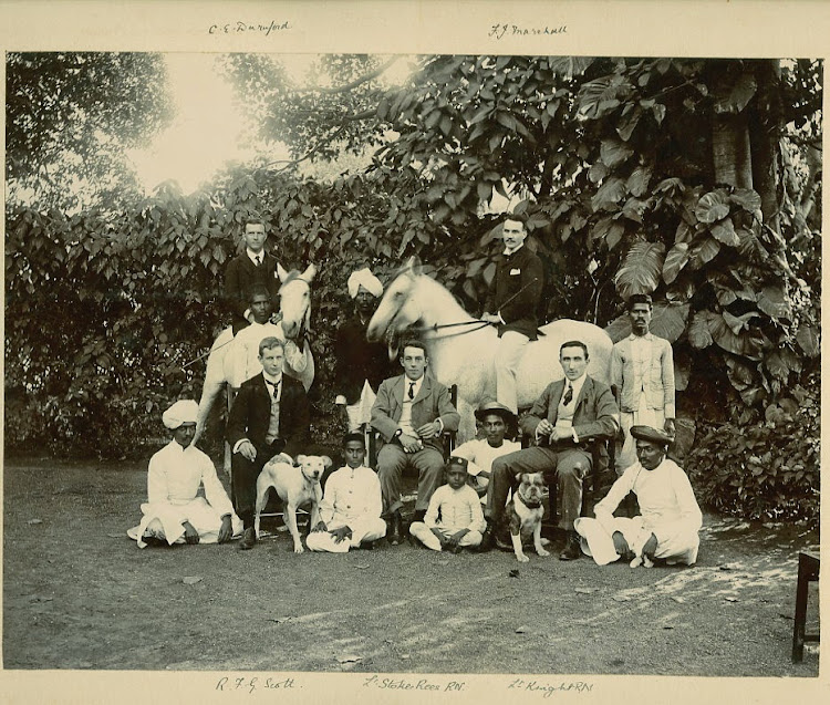 Group Photograph of Indian and European Men with Children and Dogs - c1900's