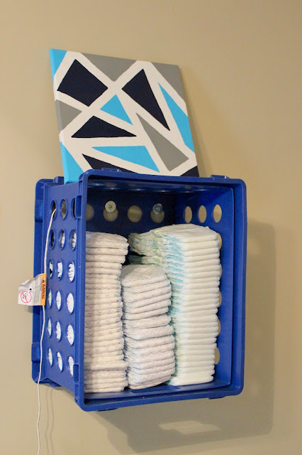 diaper stacker, diaper storage, diaper holder, DIY diaper holder, DIY diaper stacker, DIY diaper storage, diaper hacks, mom hack, affordable diaper holder, easy diaper holder, affordable diaper storage, diapers, baby hack, baby decor, nursery decor, plastic crate storage, organizing tips, diaper crate