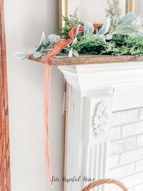 edge of Christmas mantel draping velvet ribbon