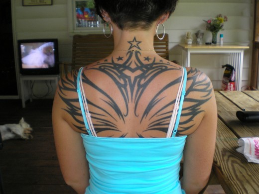 2011 butterfly tattoo lower back design for Female