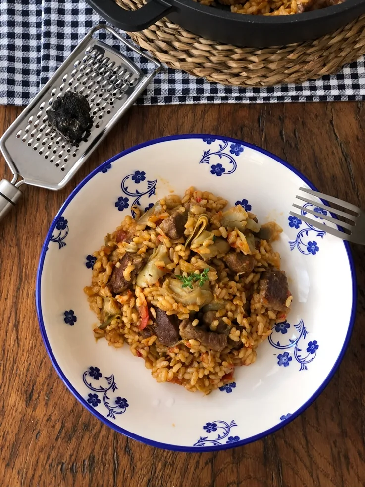 Arroz con pluma ibérica, alcachofa y trufa