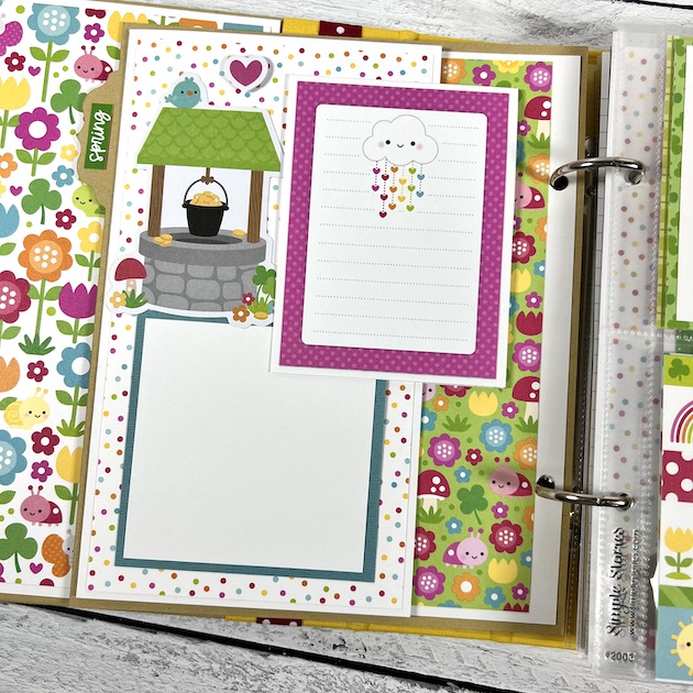 Spring Scrapbook Album Page with flowers, ladybugs, a wishing well, & a pot of gold