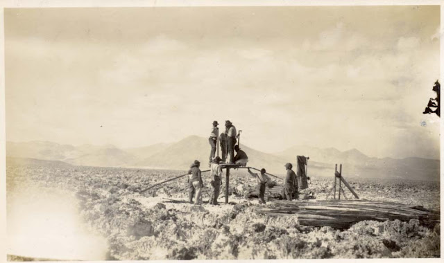 Commencing work with the 'Empire' drill. Unknown location, Chile. From the W.J. Reynolds Collection. c. 1922.