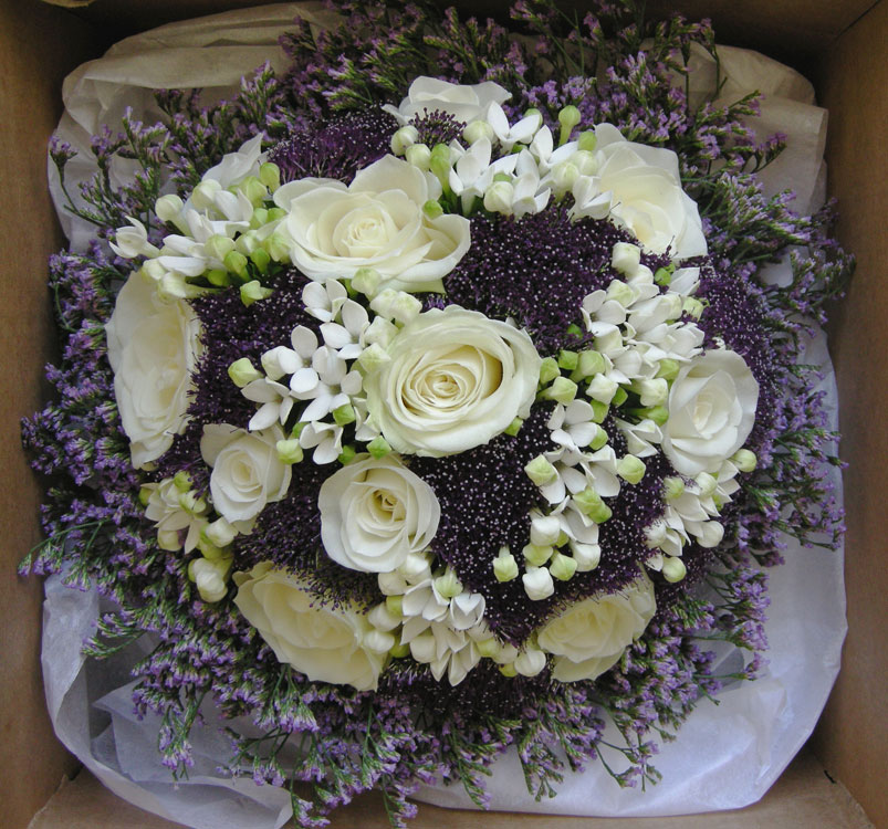 Sam's bouquet of roses bouvardia purple trachelium and lavender limonium
