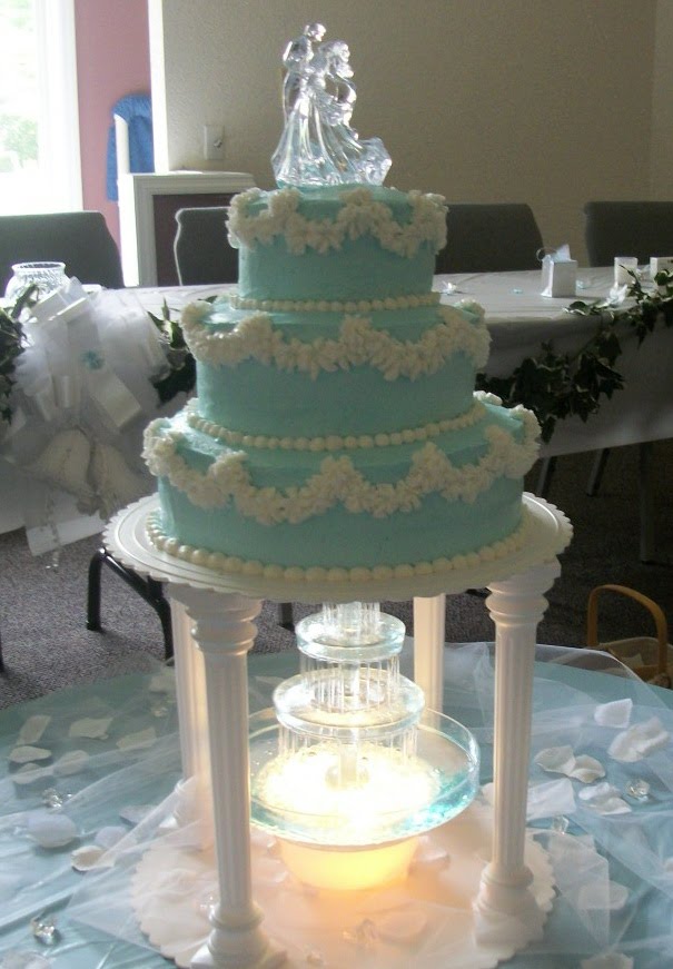 An elegant 3tiered chocolate wedding cake was accented with