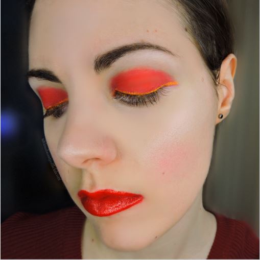 Close up of Ultima Beauty, eyes closed, Wearing Kansas City Chiefs inspired makeup colors