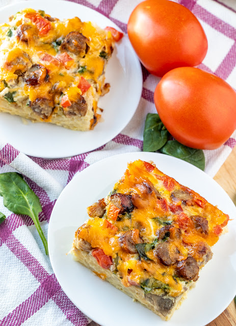 This breakfast casserole is great for Sunday morning breakfast, brunch or serve for the holidays! Tons of flavor from cheese, sausage, mushrooms, spinach, tomatoes, hash browns and onion. Simple to make and enough to feed the whole family!