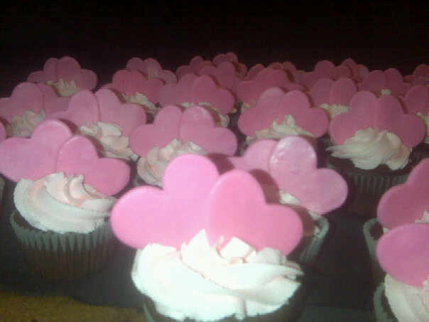 Chocolate cupcakes pink buttercream icing topped with fondant heartsfor 