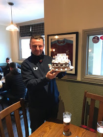 Picture: Lee Fielden with the cake presented to him in 2018 to mark his 500th game as manager of Barnetby United Football Club - see Nigel Fisher's Brigg Blog