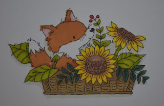 Colour in the fox and flowers with promarker pens
