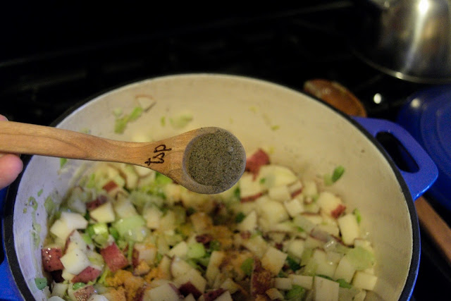 Pepper being added to the dutch oven.